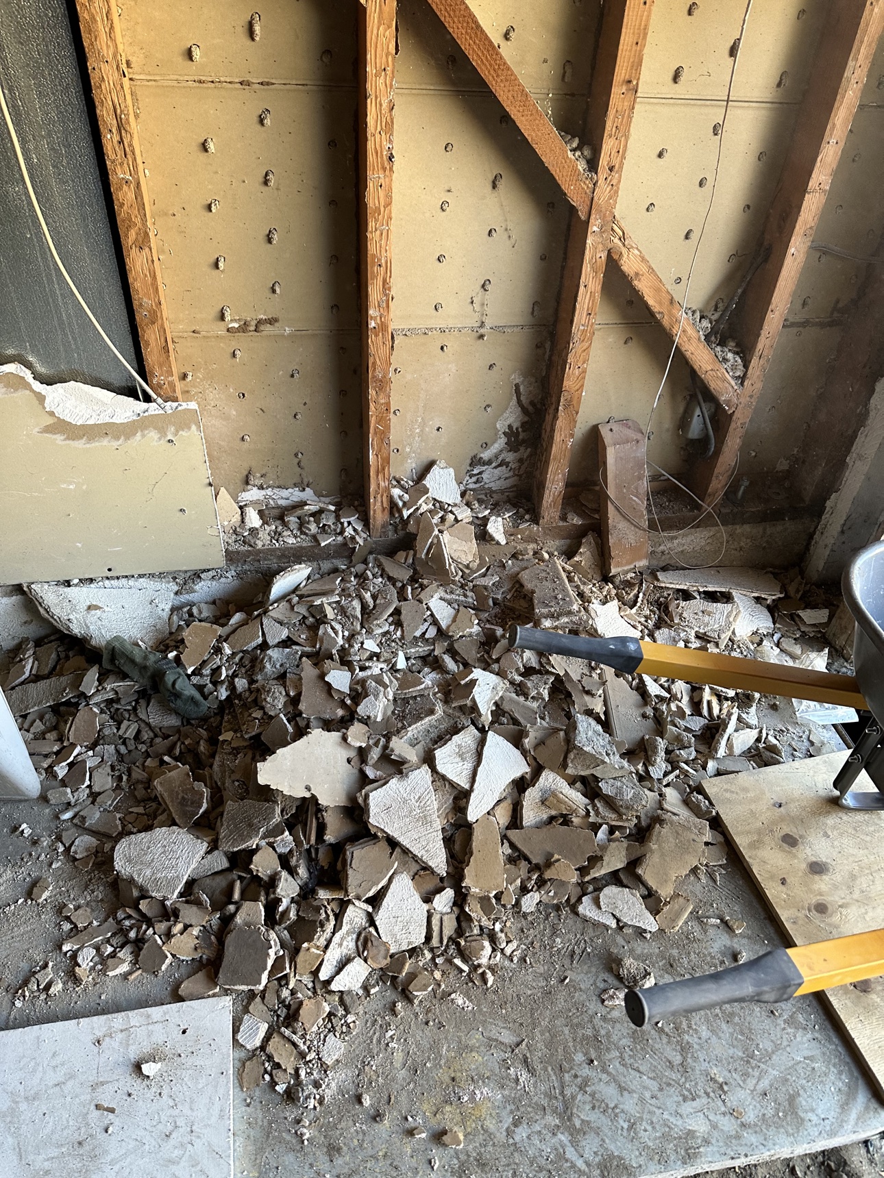 Before: Riverside garage floor buried in demolition debris
