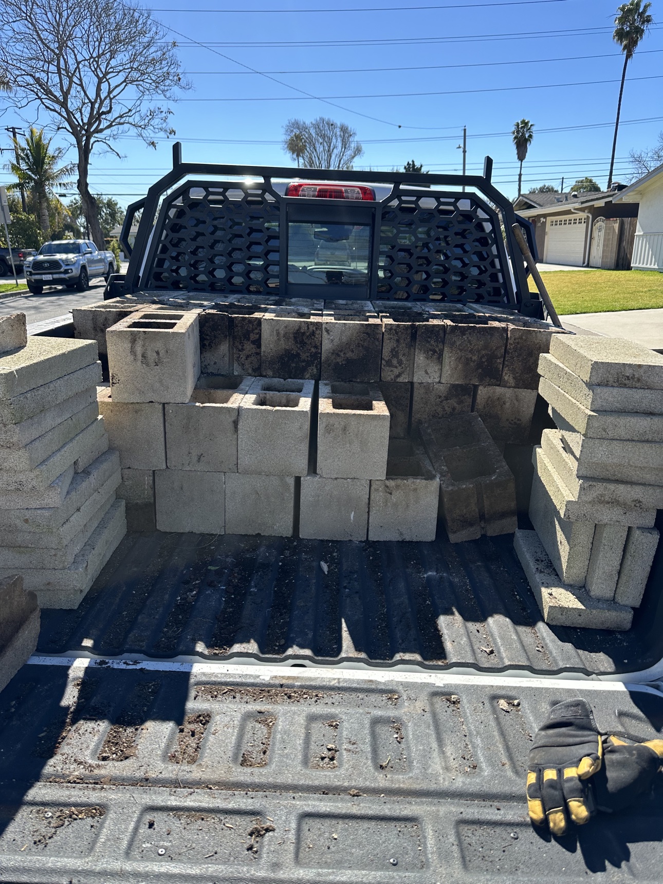 Haul-away: dismantled cinder blocks stacked in the bed of Delta’s truck