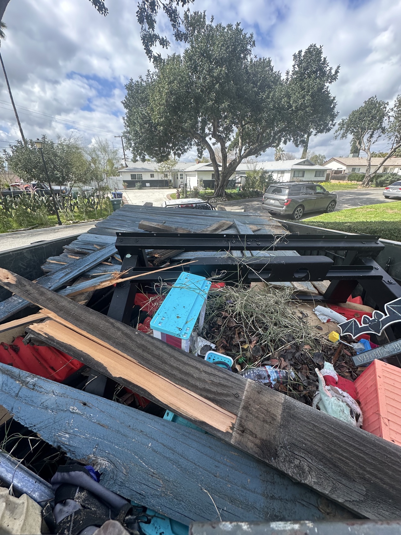 The haul: Delta trailer loaded with lumber, yard debris and cleared backyard items in Moreno Valley