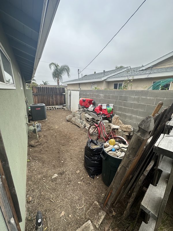 Backyard junk removal — Before
